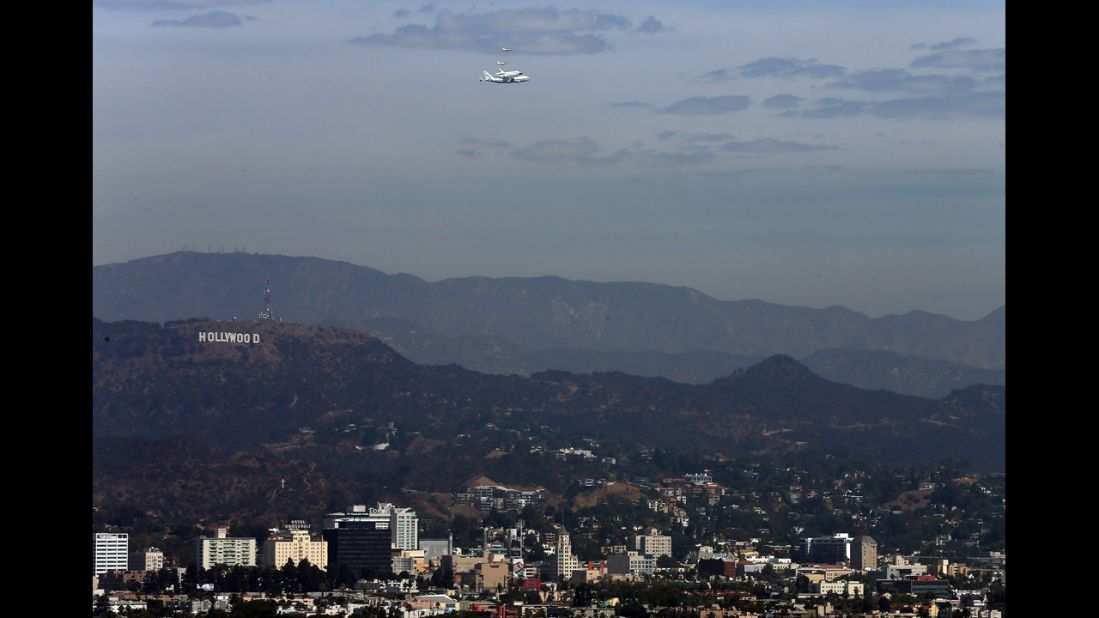 Endeavour flies near the Hollywood sign on Friday.