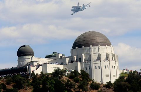 Endeavour flies over the Griffith Park Obervatory on Friday in Los Angeles.