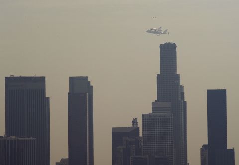 Endeavour flies over the U.S. Bank Tower, the tallest building in California, in downtown Los Angeles on Friday.