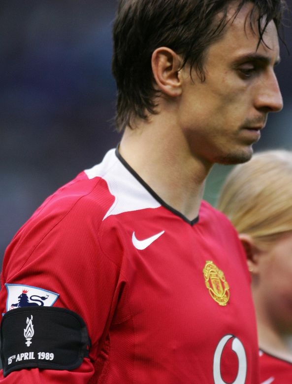 At times, the two sets have fans have used the two tragedies as a way of trying to provoke each other. On the pitch, this picture shows Manchester United captain Gary Neville wearing a black armband in honor of the Hillsborough victims during a match in 2004.