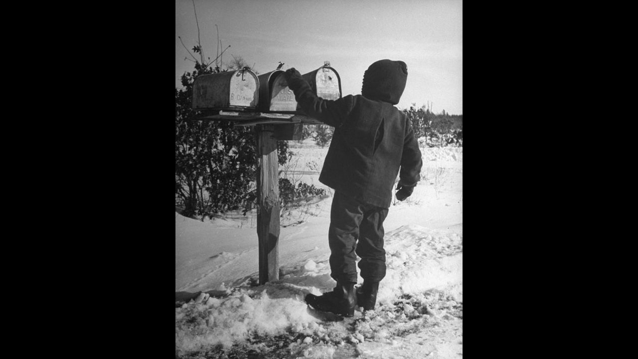 A Wisconsinite opens the family mailbox in 1946. <a href="http://life.time.com/history/the-postal-service-classic-photos/#1" target="_blank" target="_blank">See more photos of the classic Postal Service from Life.com</a>. 