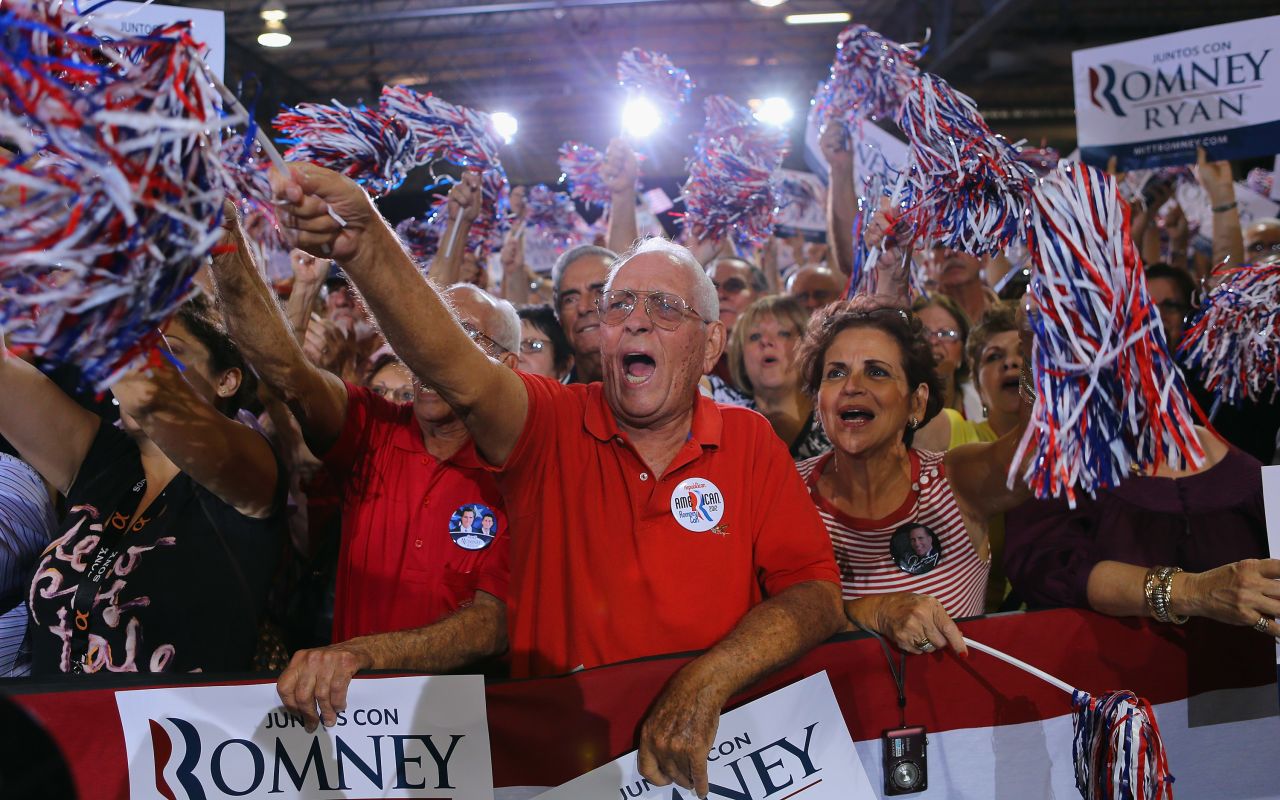 Supporters cheer as they listen to Romney speak during a Juntos Con Romney Rally at the Darwin Fuchs Pavilion on Wednesday, September 19, in Miami.