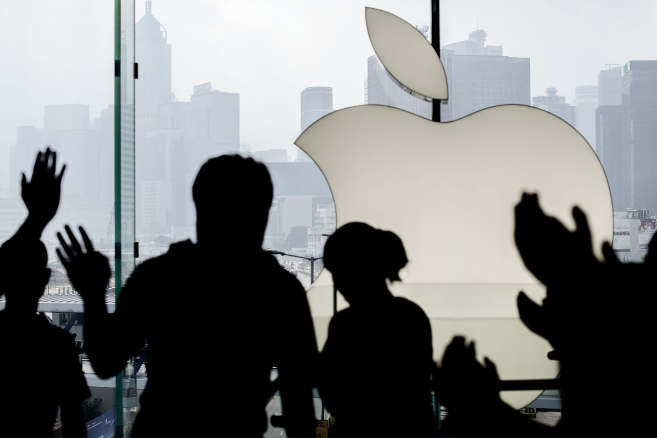 Apple employees greet a customer in Hong Kong.