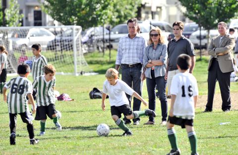 From left to right: Mitt Romney, his wife Ann, and son Tagg watch one of Tagg's sons play soccer in Belmont, Massachusetts, on Saturday.