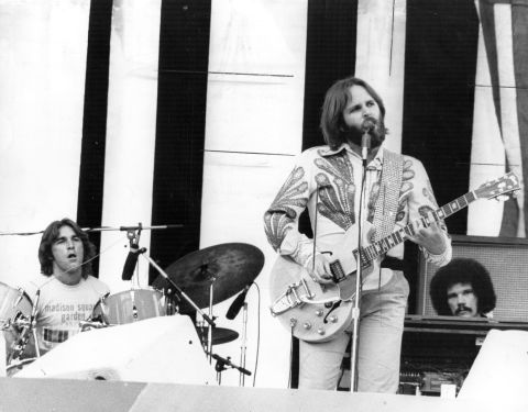Carl Wilson performs guitar and vocals and Dennis Wilson drums in a live performance, July 1975.