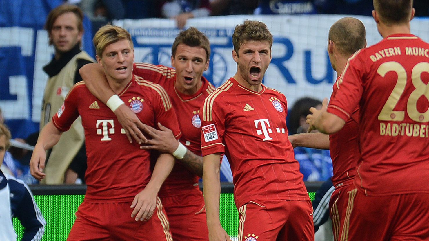 Bayern's players celebrate a goal for Thomas Mueller in their impressive win over Schalke in the Bundesliga.