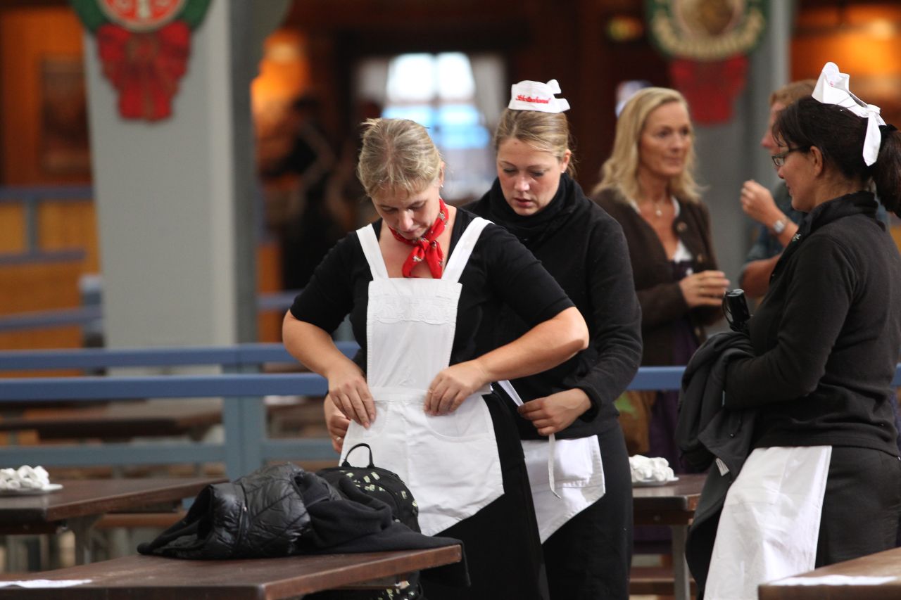 Waitresses prepare for the opening day of Oktoberfest 2012.