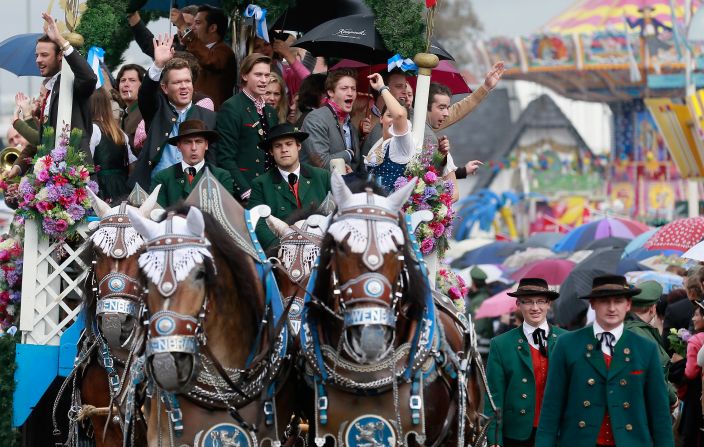 Horses pulling a beer coach march in the parade.