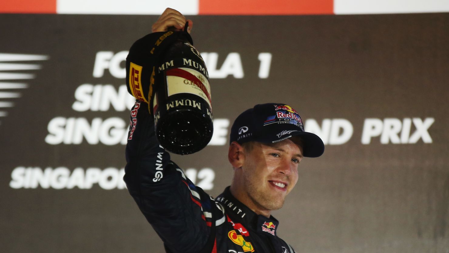 Sebastian Vettel celebrates after securing victory in Singapore for the second consecutive year.