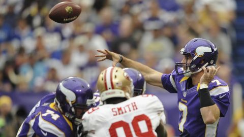 Christian Ponder of the Vikings fires a pass downfield.