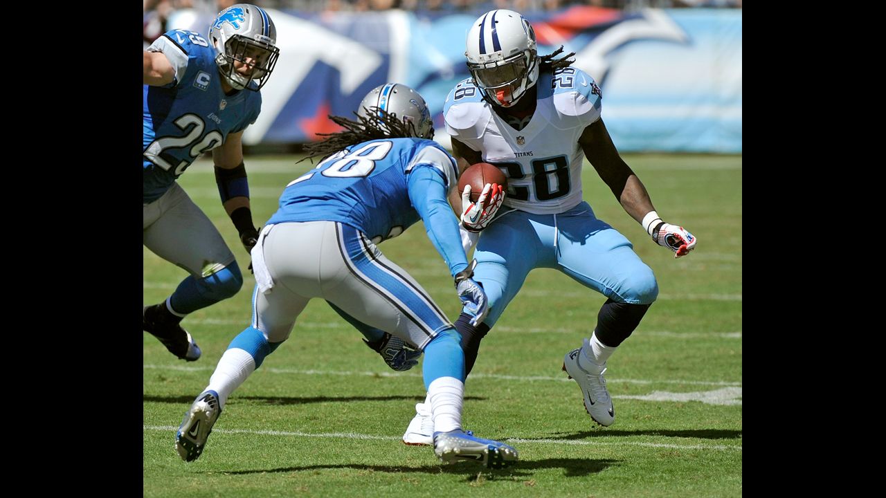 Bill Bentley of the Detroit Lions squares up to try to tackle Chris Johnson of the Tennessee Titans.