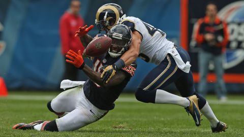 Brandon Marshall of the Bears tries to catch a pass Sunday as he is hit by the Rams' Craig Dahl.