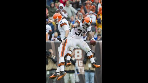 Browns quarterback Brandon Weeden, left, celebrates with Richardson after the rookie running back's touchdown against the Bills.