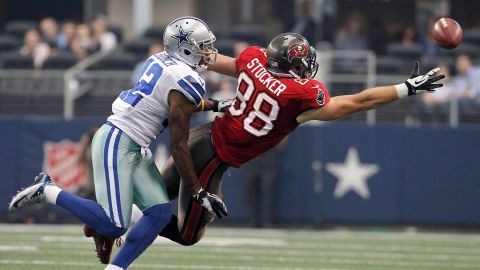 Barry Church of the Dallas Cowboys pressures Luke Stocker of the Tampa Bay Buccaneers.