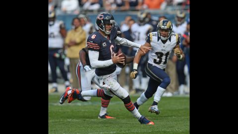 The Bears' Jay Cutler runs for a first down against the Rams.