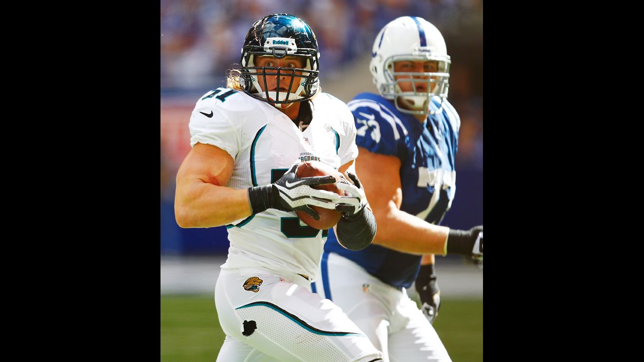 Paul Posluszny of the Jacksonville Jaguars looks for a teammate to lateral to after an interception against the Indianapolis Colts.