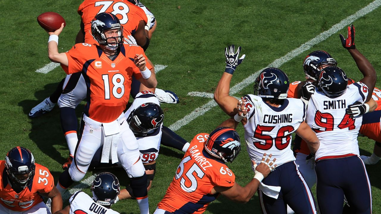 Peyton Manning of the Denver Broncos drops back to pass Sunday against the Houston Texans.