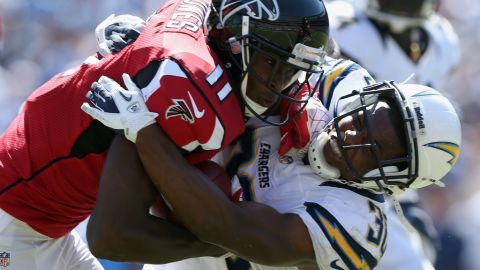 Atlanta's Julio Jones is brought down by San Diego's Marcus Gilchrist.