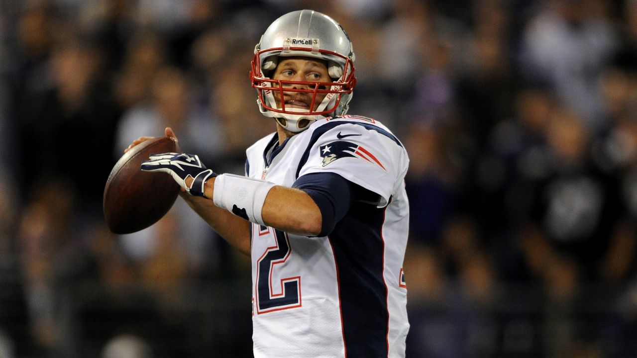 Patriots quarterback Tom Brady throws a pass in the first half against the Ravens.