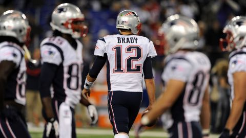 Patriots quarterback Tom Brady takes the field for Sunday night's game against the Ravens.