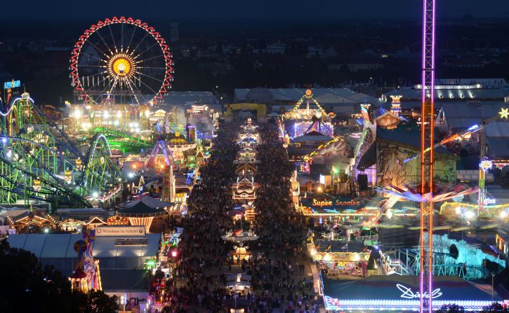 The attractions light up the fairgrounds on the first night of the festival on Saturday.