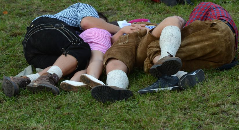 Visitors rest on the grass on Sunday.