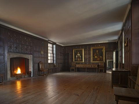 One of the first Tudor homes to be made from brick, many of its original features -- including a vast stone fireplace and a wall of intricately carved dark wood panels -- remain to this day. 