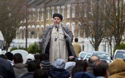 Abu Hamza al-Masri addresses followers near Finsbury Park mosque in London in 2004.