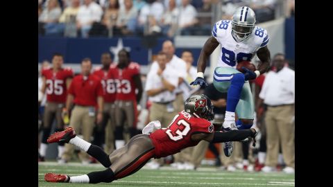 Dez Bryant of the Dallas Cowboys runs the ball Sunday against Ahmad Black of the Tampa Bay Buccaneers.