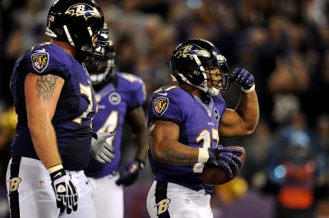The Ravens' No. 27 Ray Rice celebrates after he scored a seven-yard rushing touchdown in the third quarter against the New England Patriots on Sunday.