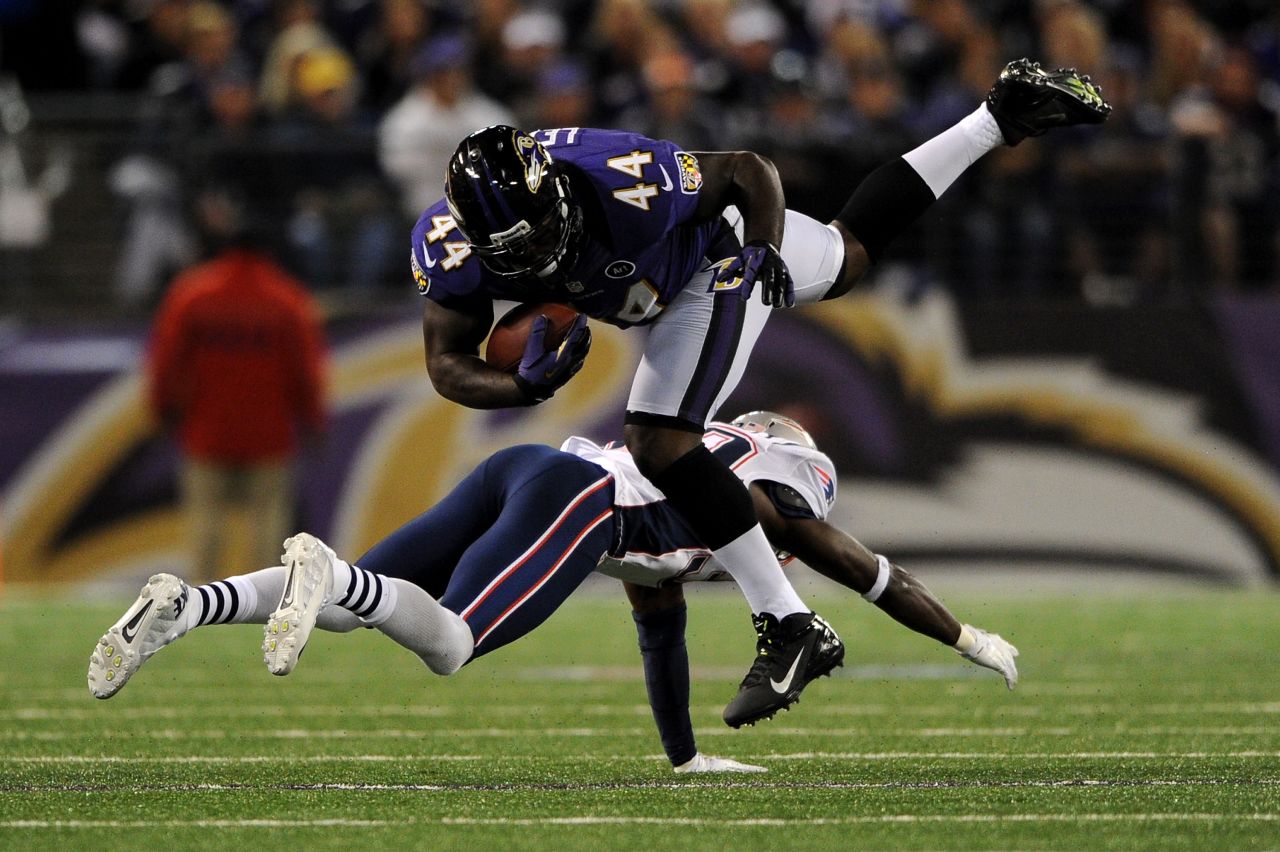 Vonta Leach of the Baltimore Ravens moves the ball for a seven-yard gain against the New England Patriots on Sunday.