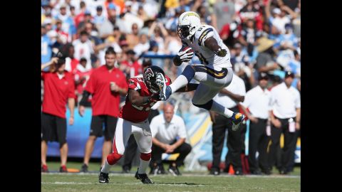 Tight end Randy McMichael of the San Diego Chargers leaps in front of Dominique Franks of the Atlanta Falcons on Sunday in San Diego. The Falcons defeated the Chargers 27-3.