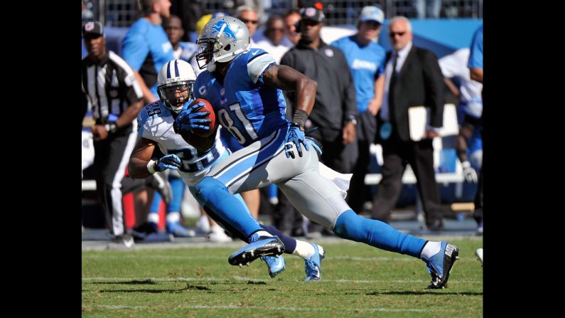 Calvin Johnson of the Detroit Lions runs after catching a pass against the Tennessee Titans.