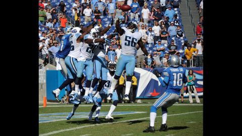 No. 56 Akeem Ayers of the Titans bats down a hail mary pass intended for the Lions' Titus Young.