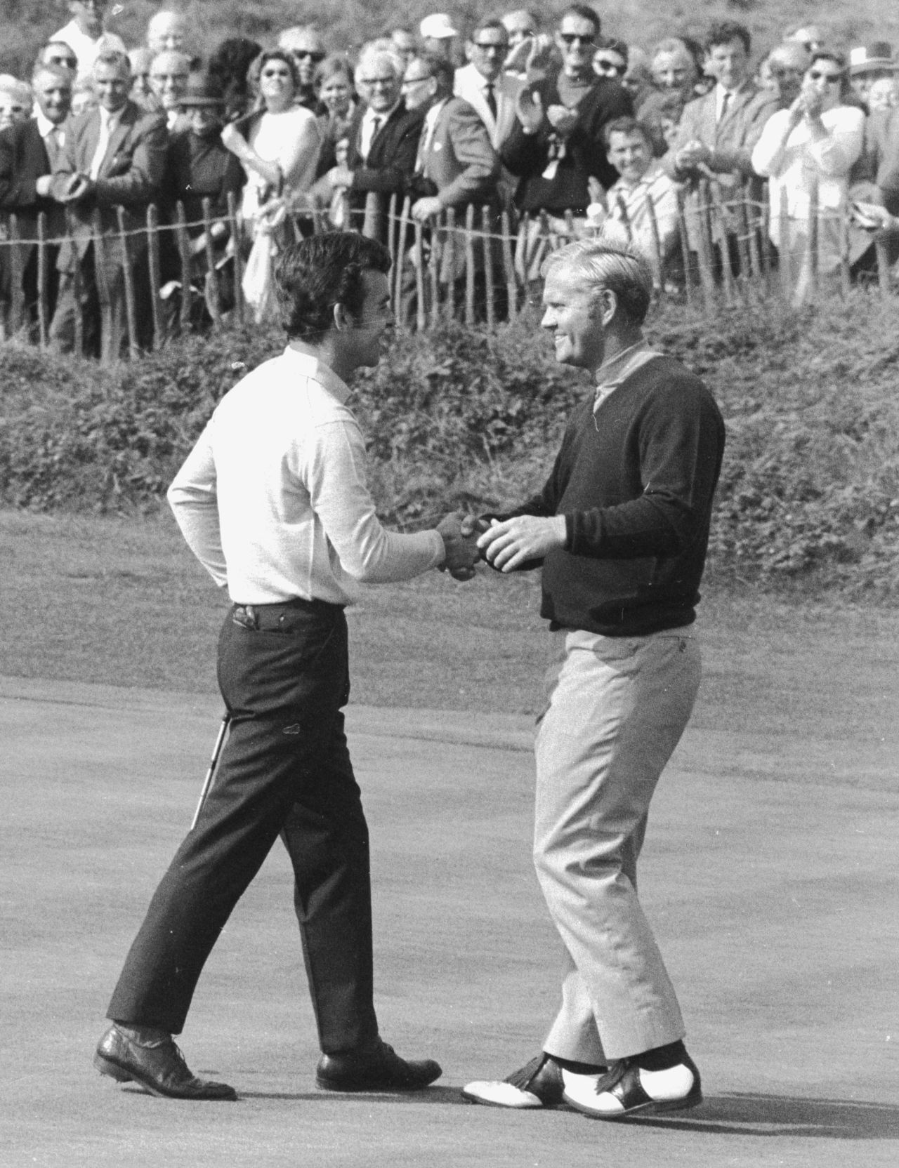 Tony Jacklin and Jack Nicklaus shake hands at the end of their famous tied singles match at Royal Birkdale in 1969 -- leaving the overall match tied at 16-16 in a gripping encounter. Nicklaus conceded a tricky putt for Jacklin on the last green in a famous act of sportmanship.