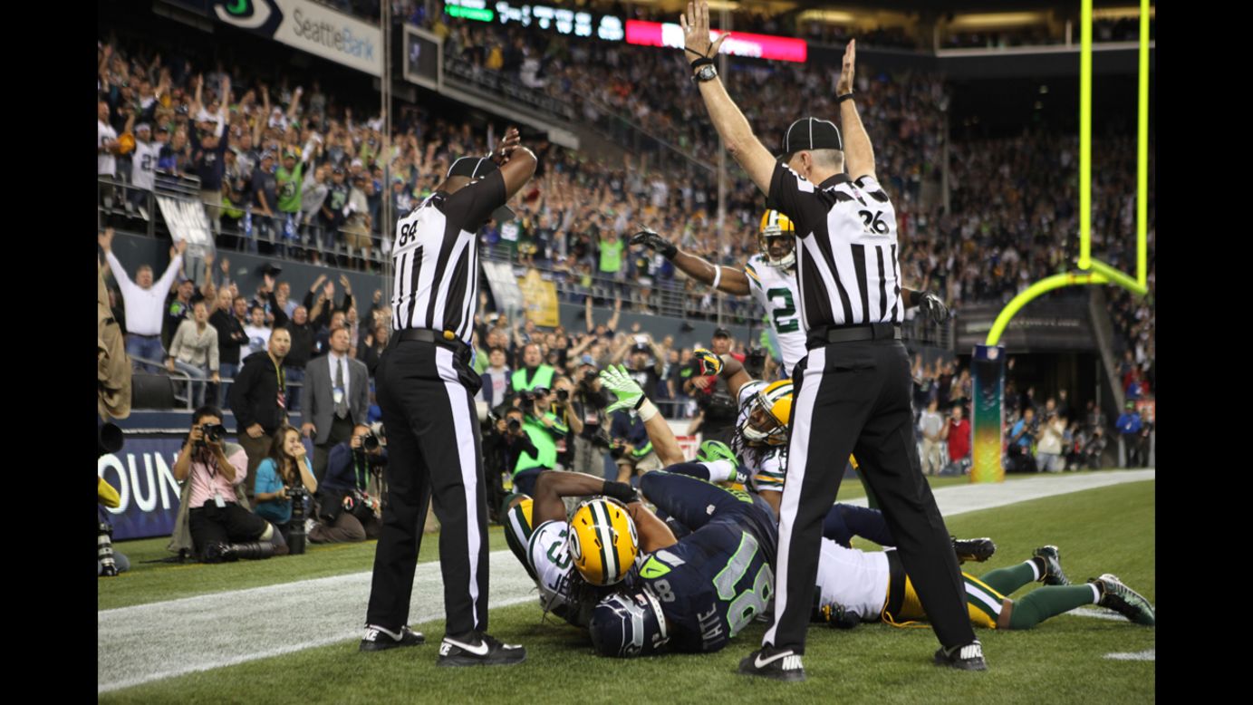 On Twitter, this is being called the "official photo" of the replacement referee debacle. Two officials in the end zone gave contradictory signals: One signaled a touchdown and the other signaled a clock stoppage, indicating a change of possession and an interception.