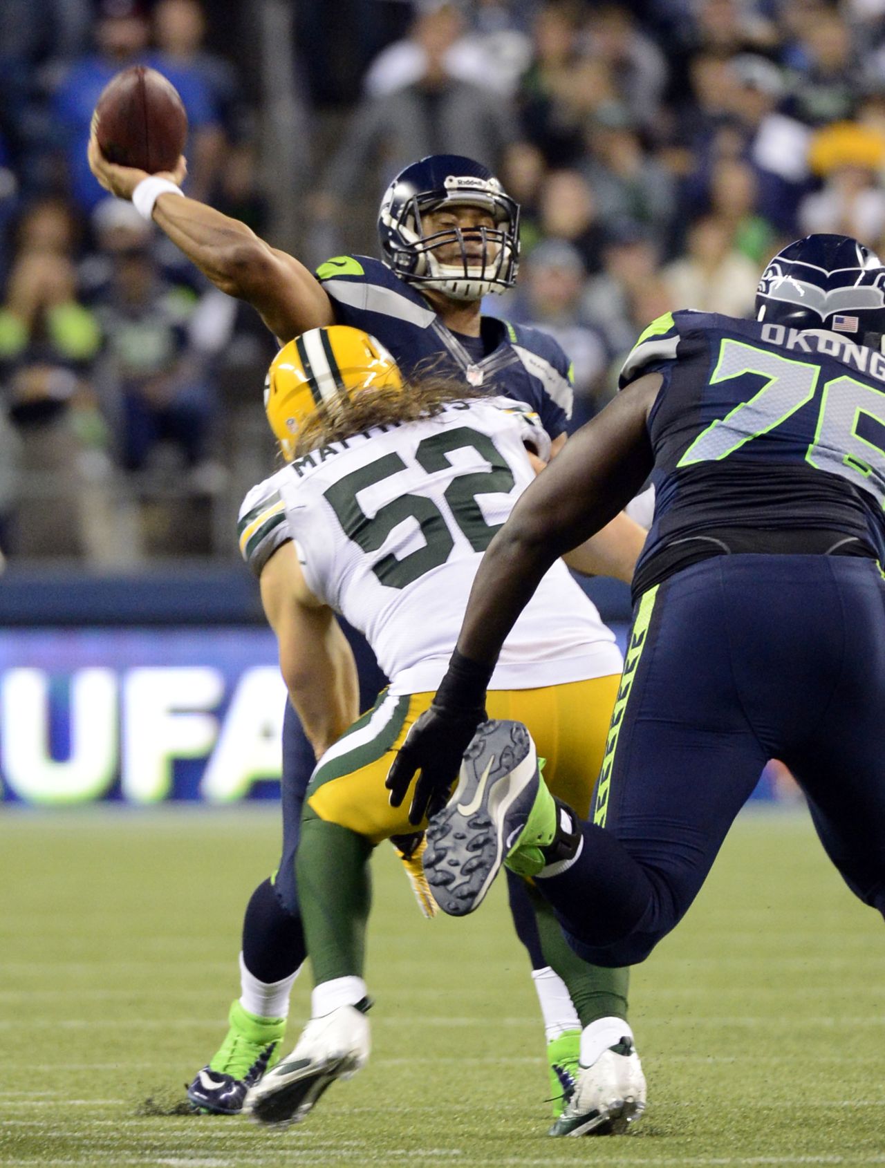 Seattle Seahawks quarterback Russell Wilson throws the winning touchdown pass against the Green Bay Packers in Seattle on Monday night. The Seahawks defeated the Packers 14-12 after a much-questioned call by the referees. 