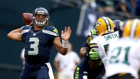Quarterback Russell Wilson of the Seattle Seahawks throws a pass in the first half against the Green Bay Packers on Monday.