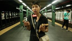 People on the subway step up to CNN's Open Mic to talk about how they use their cell phones.