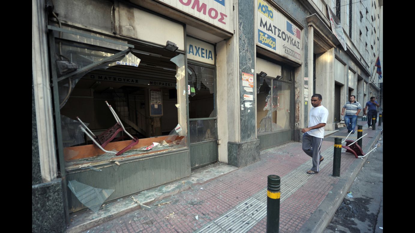 Protesters smashed the windows of a store during a demonstration in central Athens.