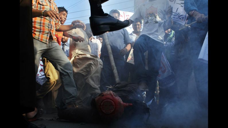 Pakistani demonstrators beat an effigy of Florida pastor Terry Jones during a protest against an anti-Islam film in Lahore on Monday, September 24. More than 50 people have died around the world in violence linked to protests against the low-budget movie, which mocks Islam and the Prophet Mohammed, since the first demonstrations erupted on September 11. <a href="index.php?page=&url=http%3A%2F%2Fwww.cnn.com%2FSPECIALS%2Fworld%2Fphotography%2Findex.html">See more of CNN's best photography</a>.