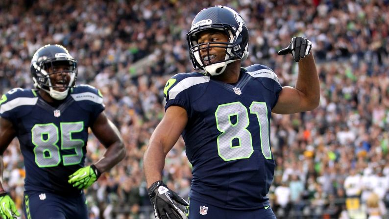 Seattle's Golden Tate, right, celebrates after scoring a 41-yard touchdown in the second quarter Monday.