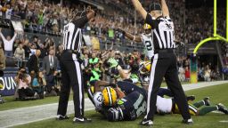 Officials in the end zone give different signals on the final play of the Green Bay-Seattle game on Monday night. The Seahawks beat the Packers 14-12 on a controversial call in the end zone on the final play at CenturyLink Field in Seattle. Check out the action from Week 3 of the 2012 National Football League season. Look back at the best of Week 2 and see more of CNN's best photography.
