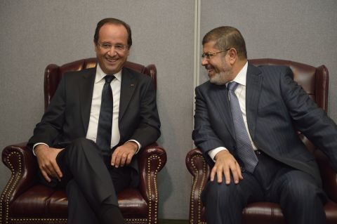 French President Francois Hollande, left, and his Egyptian counterpart, Mohamed Morsy, talk during a bilateral meeting on Tuesday, September 25.