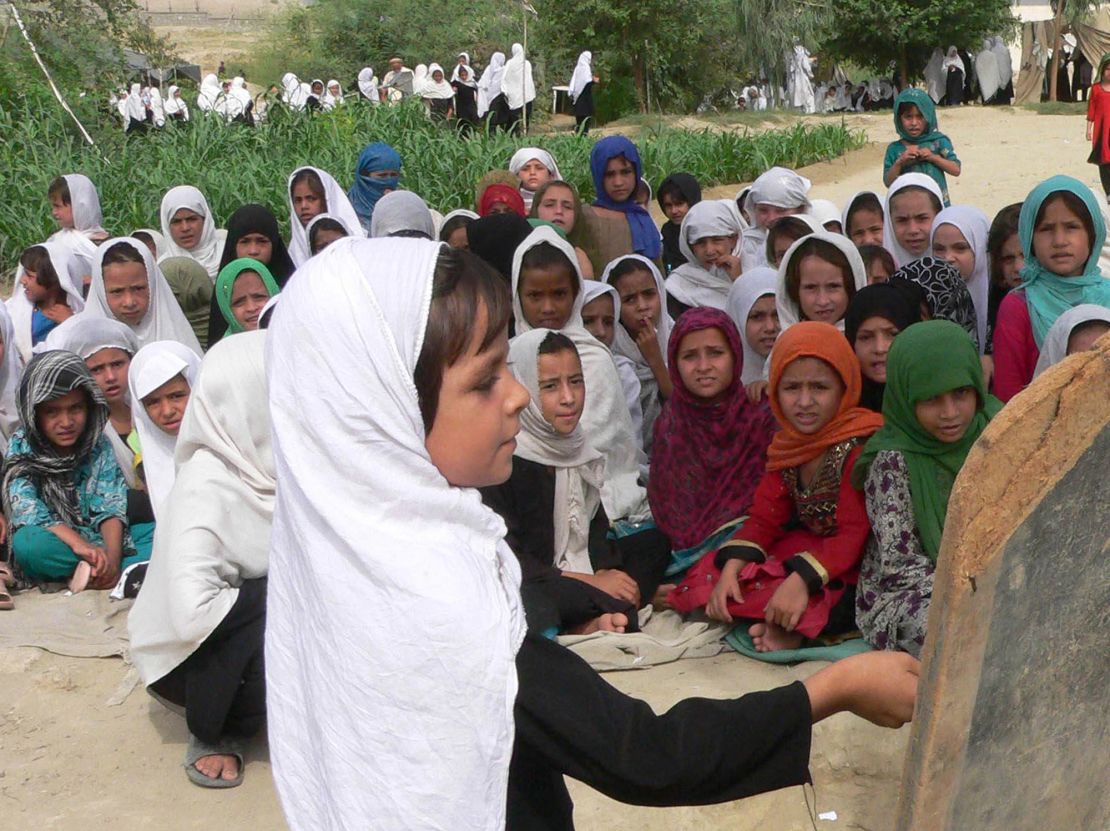 Afghan girls study in an open-air school in the outskirts of Jalalabad.