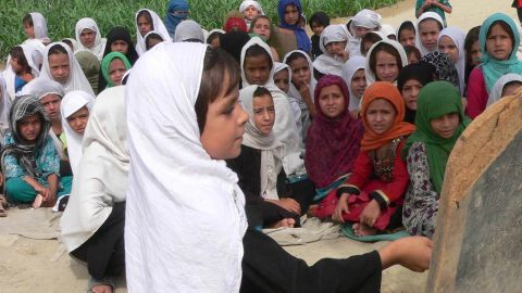 Afghan girls study in an open-air school in the outskirts of Jalalabad.