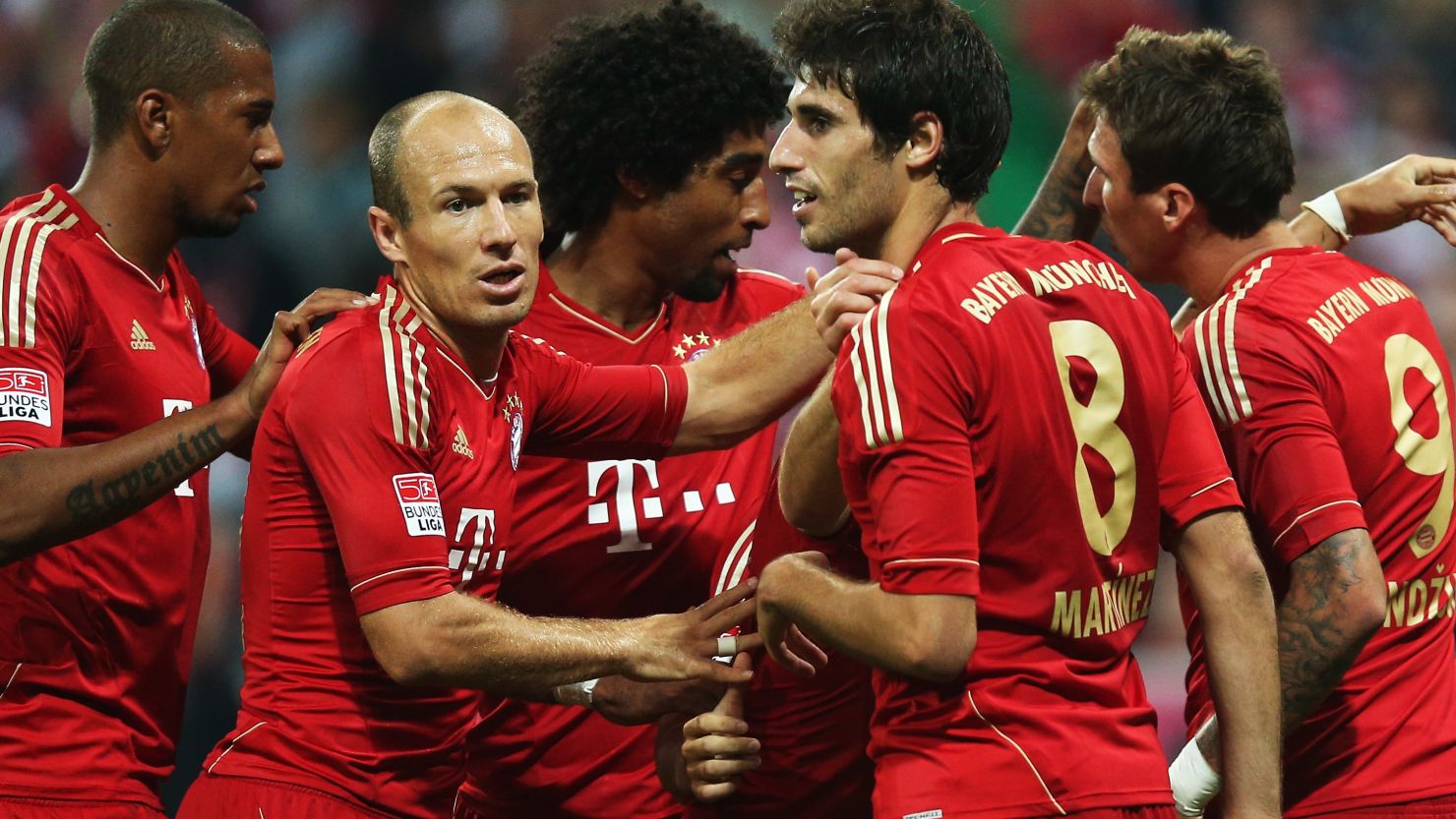 Bayern Munich's players celebrate a goal for  Mario Mandzukic in their victory over Wolfsburg at the Allianz Arena. 