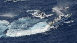A Japan Coast Guard vessel, right, sprays water against Taiwanese fishing boats in the East China Sea.