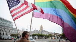 A demonstrator waves American and gay pride flags in San Francisco in 2010. California voters approved a ban on same-sex marriage.