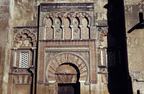 The Moorish arch at the entrance to the Mosque (or Mezquita) in Cordoba. It was consecrated as a Christian church in 1236, and in the 16th century, a cathedral nave was built in its center.